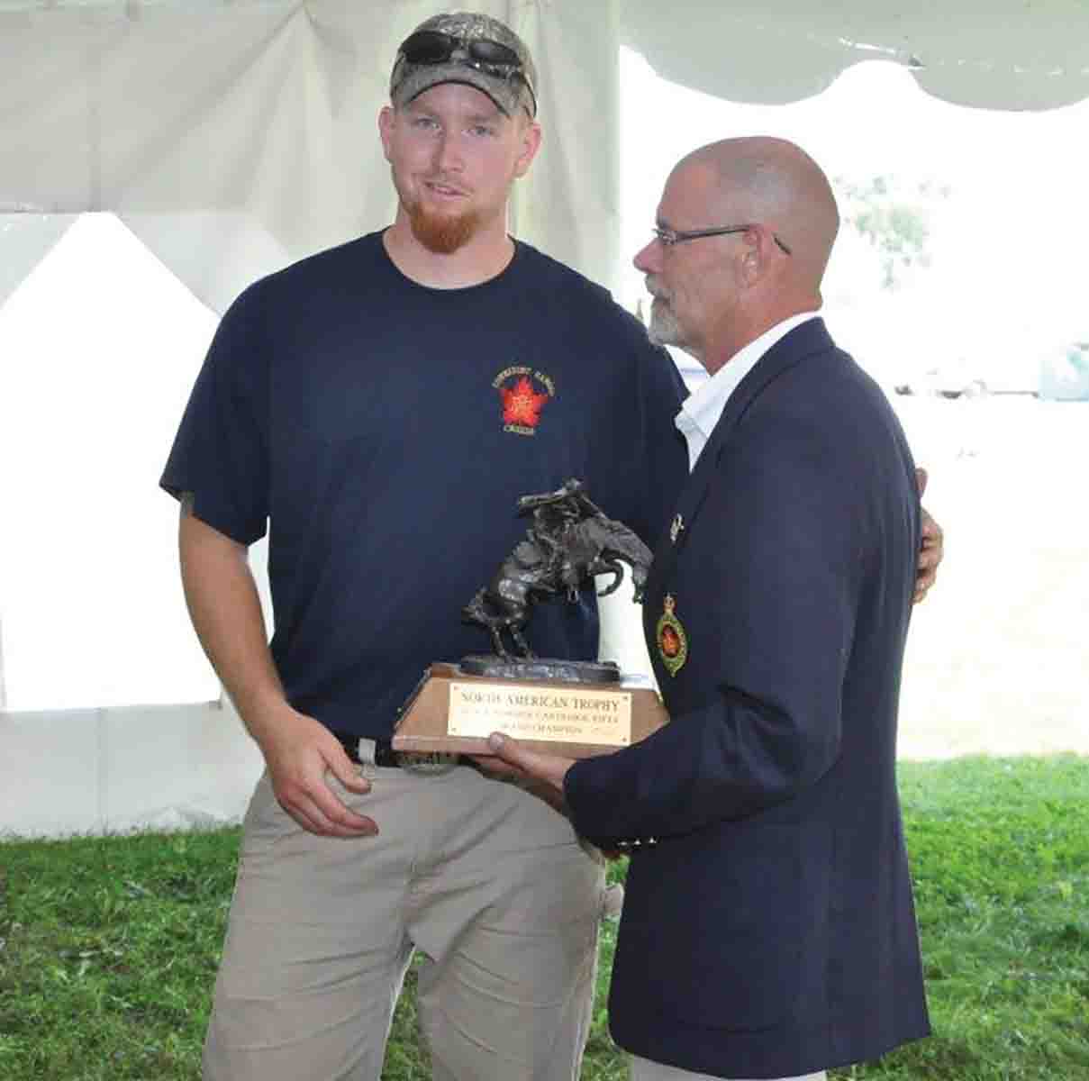In the photo, Cody Hicks is presented with the North American Trophy for his great effort in winning the Grand Aggregate in Cartridge Rifle Class, by my predecessor and past Black Powder Program Director, Chris Jones.